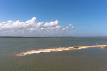 Vegetation and sand dunes of the dry mangrove (Dunas do Mangue Seco) in Bahia providing a beautiful view of the blue sea.