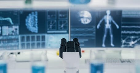 Coronavirus and human skeleton models on computer screen. Futuristic laboratory research