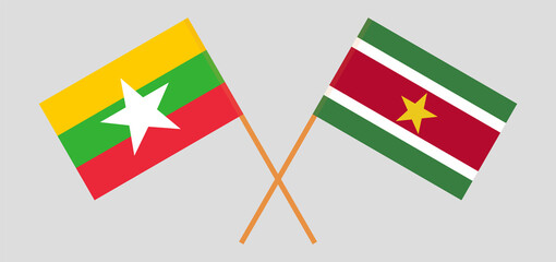 Crossed flags of Myanmar and Suriname. Official colors. Correct proportion