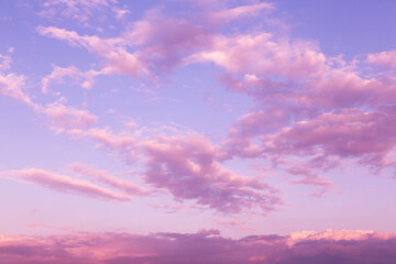 Sunrise, sunset pink violet blue sky with clouds abstract background texture