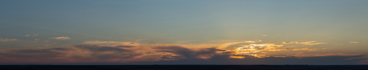 The evening sunset. Panorama. Majestic Storm Clouds. Tragic gloomy sky.
