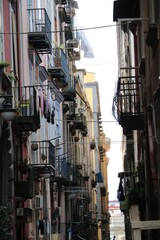 Fototapeta na wymiar Narrow dark alley in Naples, Italy