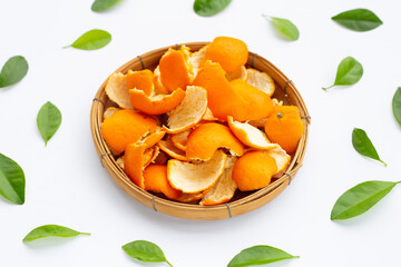Orange peels in basket on white
