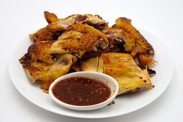 Grilled chicken with spicy sauce on white