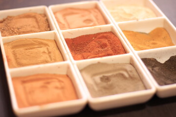 close up of dirt and different kinds of powder