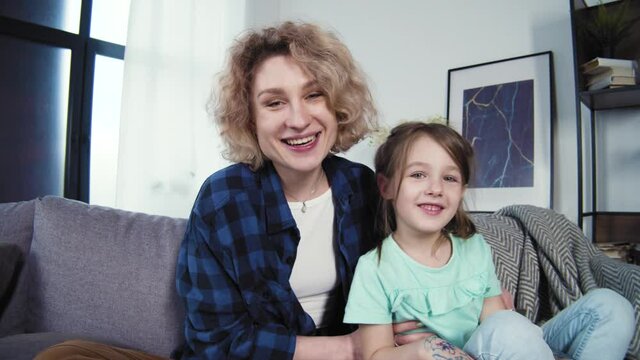 Young family talking video call from home. Happy distance mother and daughter chatting online in virtual app, web camera. Enjoying lifestyle communication. Online chat view, 4k slow motion