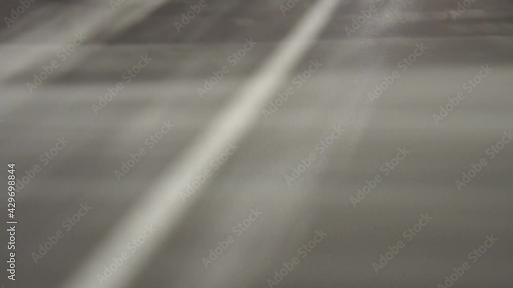 Poster illumination rays on gray surface. abstract rays of light and lens flare on a gray background. verti