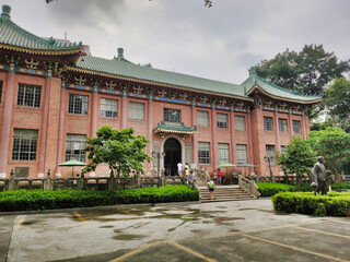 Fototapeta premium View of the library in the old historical building in chinese style and the Sun Yat Sen statue. Guangzhou. Guangdong. China. Asia