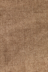 fabric grunge background, real cotton denim brown, wrinkled, frayed, close