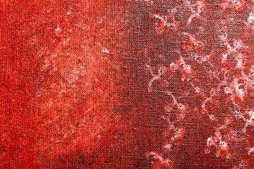 abstract creative background: white and red blurred stains of colored primer when toning the...
