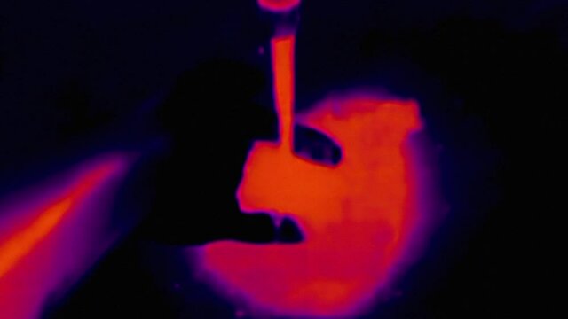 Thermal imaging view of male hands washing in the water. Infrared, thermal, night vision imaging