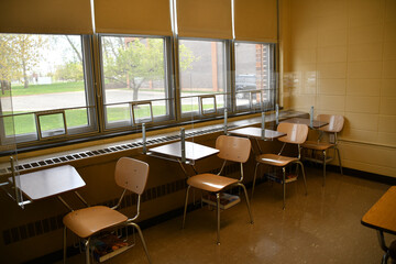 Covid pandemic shield guard protection for students in school.