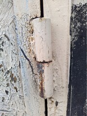 old and rusty metal door hinge closeup photo