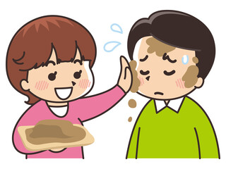 男性の顔に泥を塗る女性