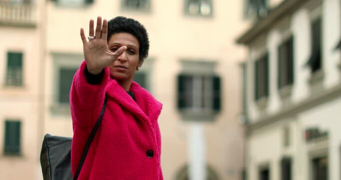 Portrait of woman making stop gesture, Pistoia, Tuscany, Italy