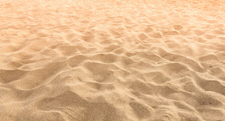 Fototapeta na wymiar Sand on the beach as background. Selective focus