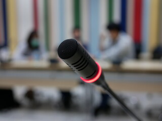 closeup of microphone in seminar room for conference.