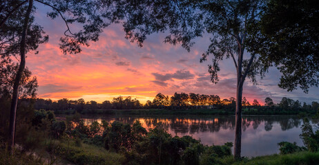 Beautiful Panoramic Riverside Sunset with Reflections