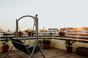 Metal swing in a terrace