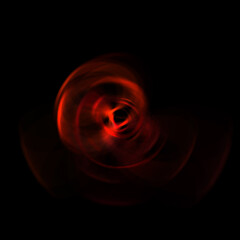 Spinning rays of light isolated on black background. Graphic 2D illustration of glowing colorful light particles in circular motion.