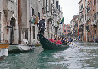 Fototapeta na wymiar The waterways of Venice , home to the famous Gondols or water taxi's ..colorful even on a dull day.The singing and serenity of this fabulous City.