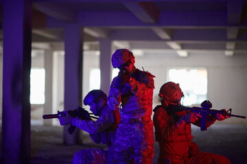 Soldiers squad in tactical formation having action urban environment