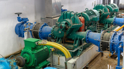 several water pumps with large electric motors