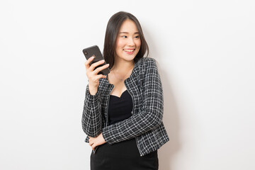 Fototapeta premium Portrait of Asian woman using mobile phone application and pointing finger to smartphone isolated over white background.