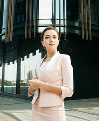 Businesswoman successful woman business person standing outdoor corporate building exterior