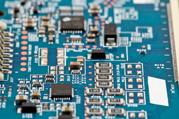 Electronic board with radio parts and chip processor from electronic device. Top view. Selective focus.