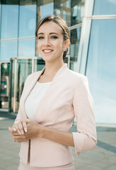 Businesswoman successful woman business person standing outdoor corporate building exterior