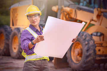 Woman engineers construction worker. Foreman working  with excavator in construction site  background