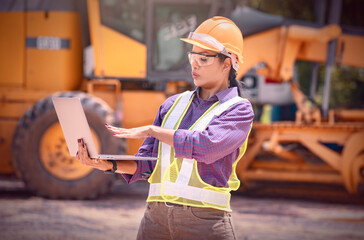 Woman engineers construction worker. Foreman working  with excavator in construction site  background