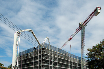  Construction progress. Concrete Boom Pump delivering on new building site. Gosford, Australia. March 30, 2021. 56-58 Beane St. Part of a series.