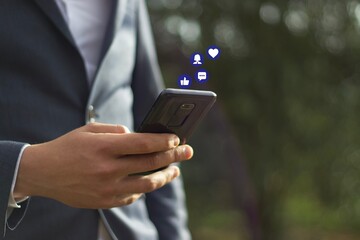 Businessman holding a cloud of social media network icon