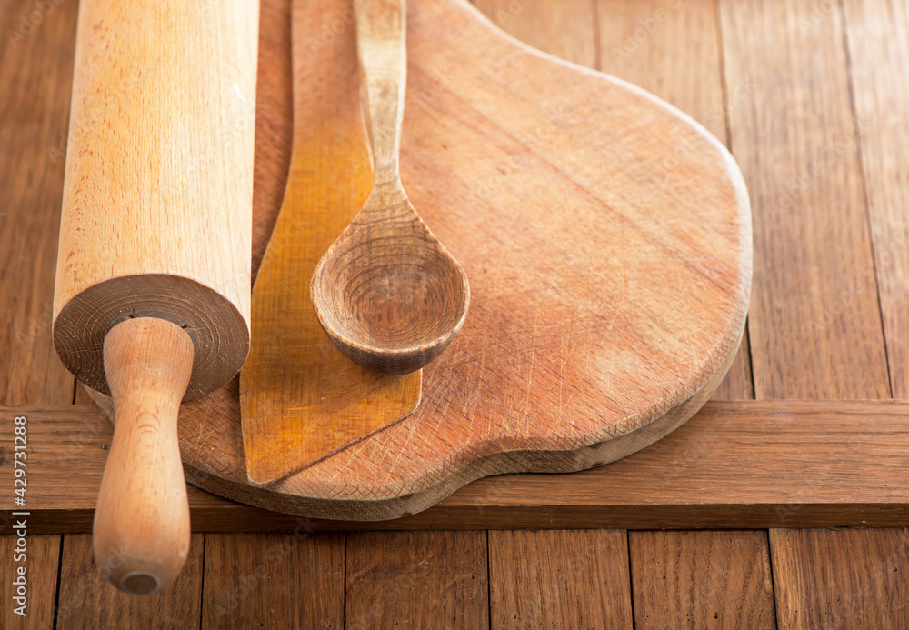 Sticker Rolling pin and wood cutting board on dark wooden table background