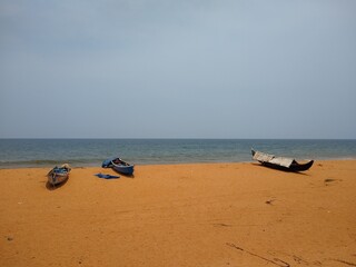 Fototapeta na wymiar fishing boats on the seashore, seascape view, Thiruvananthapuram Kerala
