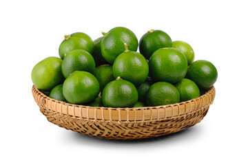 Fresh green limes in bamboo basket isolated on white background. Clipping path.