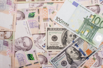 Fototapeta na wymiar Ukrainian hryvnia, American dollar, euro currency, new banknotes. Close-up. Financial background. Money background.