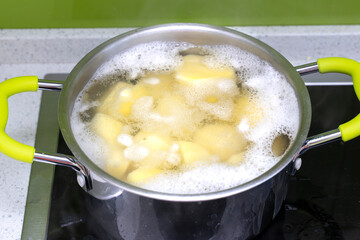 cooking process in a saucepan on an induction hob