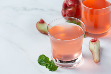 Rose apple juice on white background