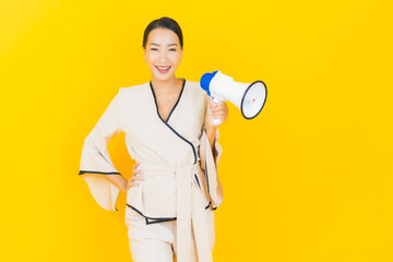 Portrait beautiful young business asian woman with megaphone