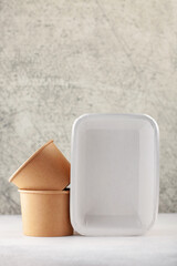 Set of  paper tableware on a gray background.  Mock up concept