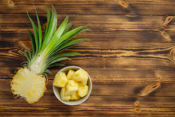 fresh pineapple on dark wooden backgroud
