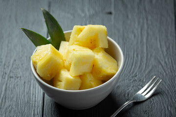 fresh pineapple on dark wooden backgroud