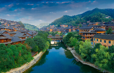 Fototapeta premium Dusk scenery of Qianhu Miao village in Xijiang, Qiandongnan, Guizhou Province, China