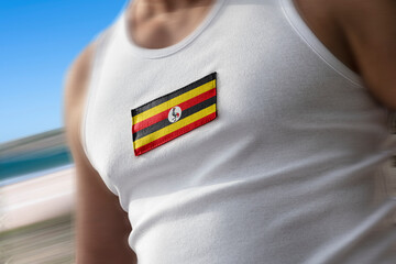 The national flag of Uganda on the athlete's chest