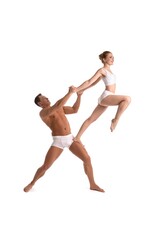 Young athletic couple doing acrobatic support exercise
