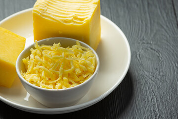 Cheddar Cheese on dark wooden backgroud