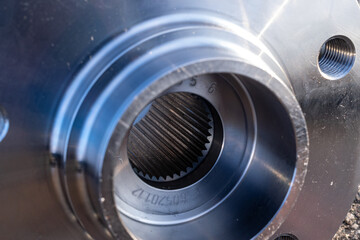 Engine gears. Auto motor mechanic spare or automotive piece on dark road asphalt background. Tarmac...